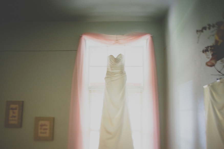 Wedding Dress Hanging in Window