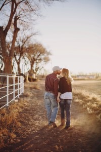 Couple kissing down path